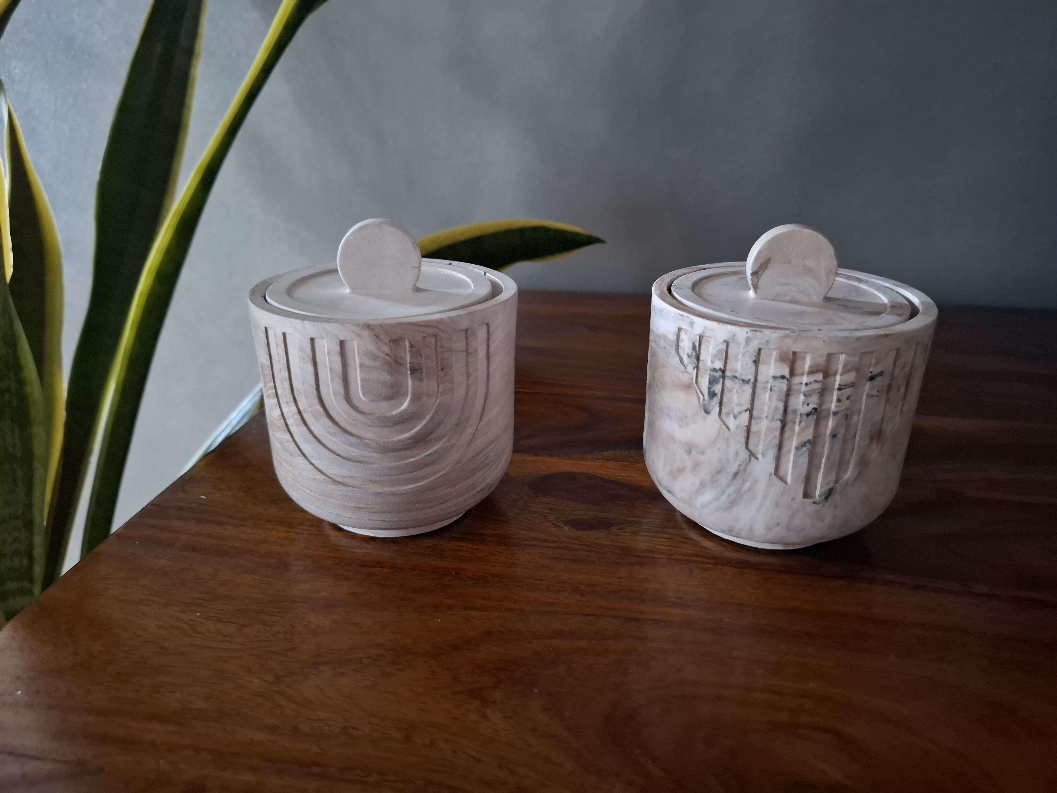 Minimalist handmade candle in gypsum container, sustainable soy wax.