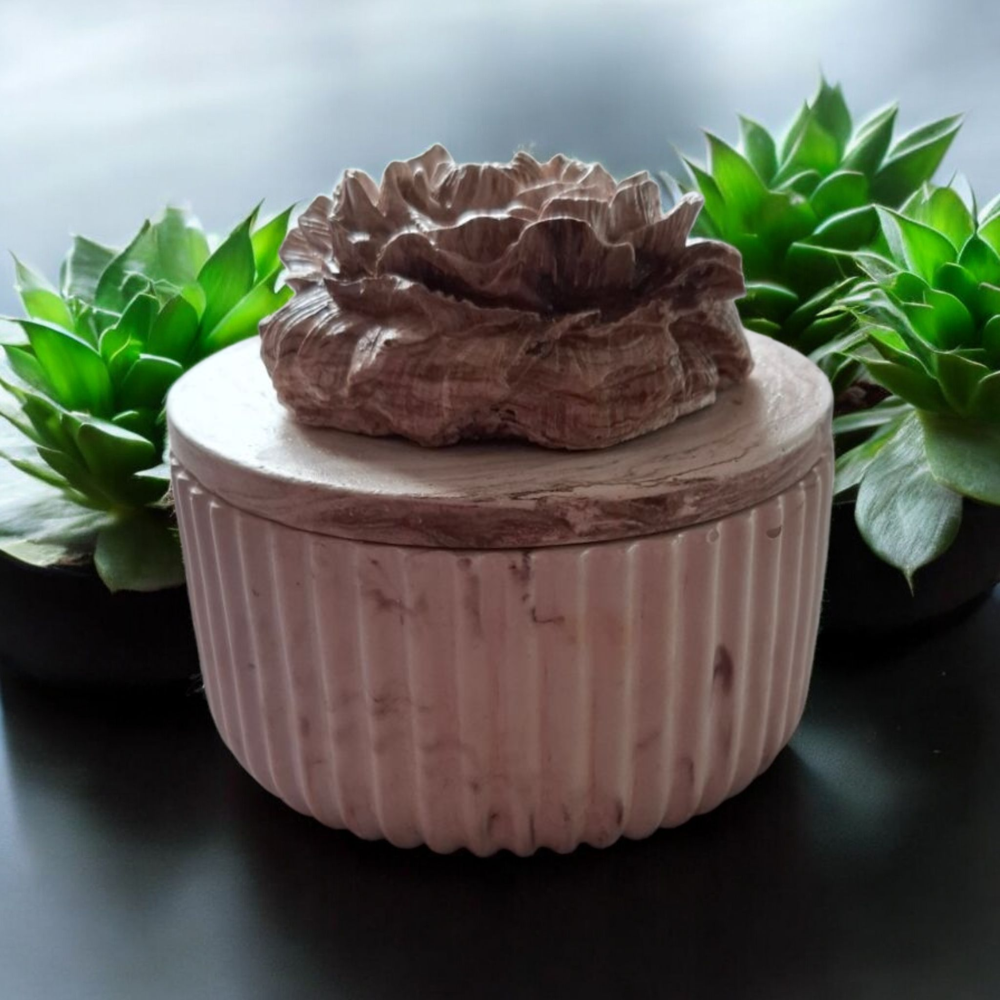 Minimalist handmade candle in gypsum container, sustainable soy wax.