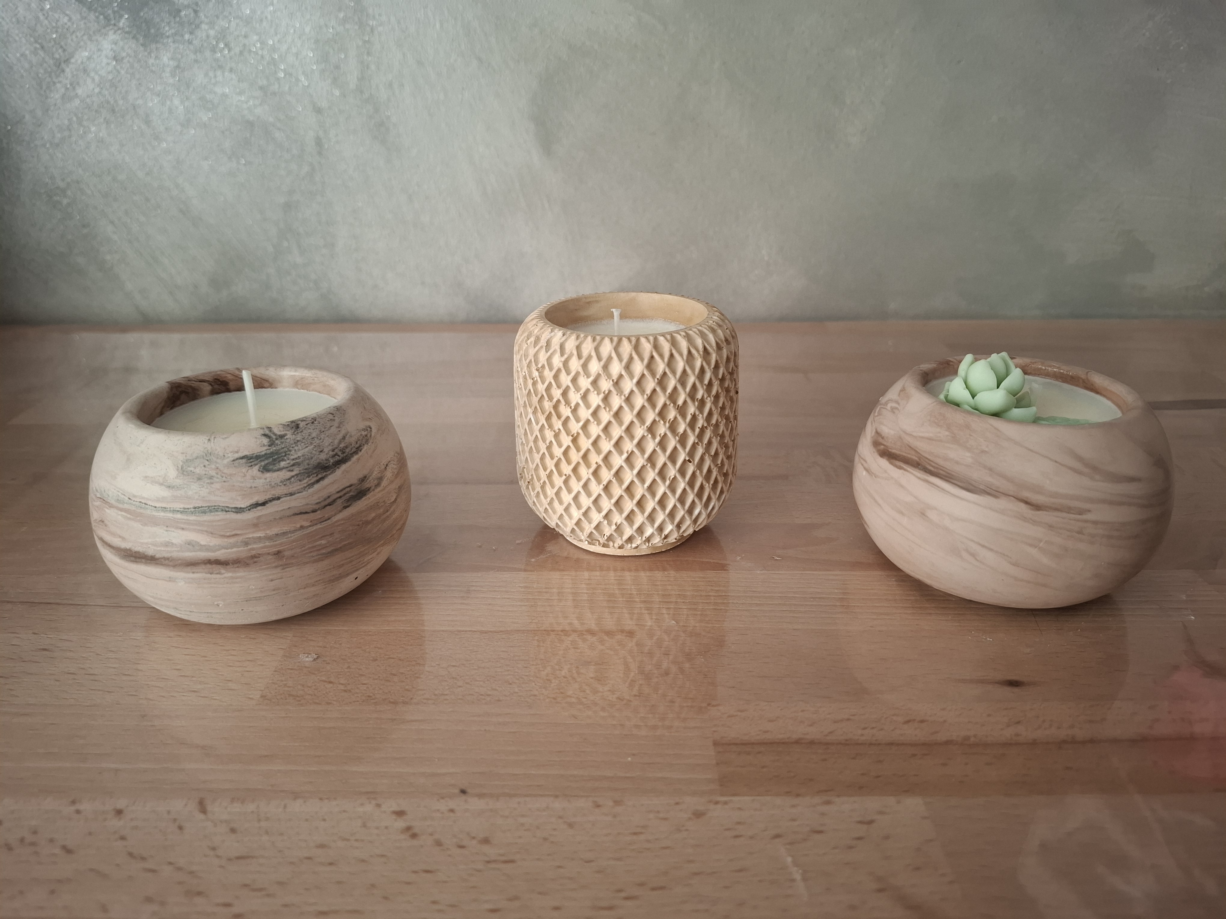 Minimalist handmade candle in gypsum container, sustainable soy wax.