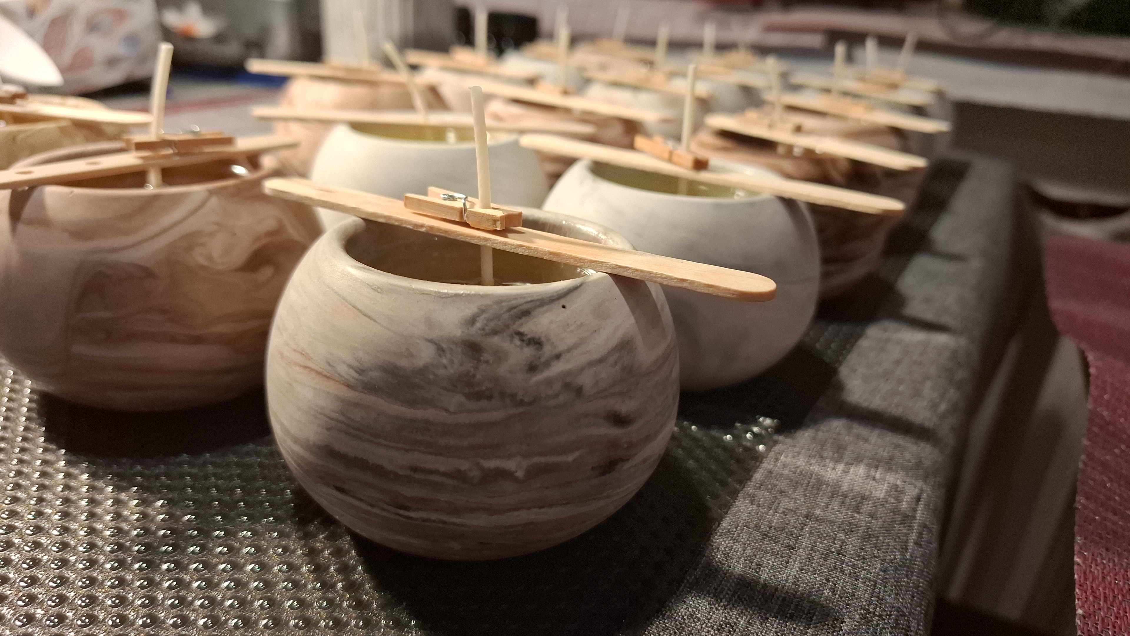 Minimalist handmade candle in gypsum container, sustainable soy wax.