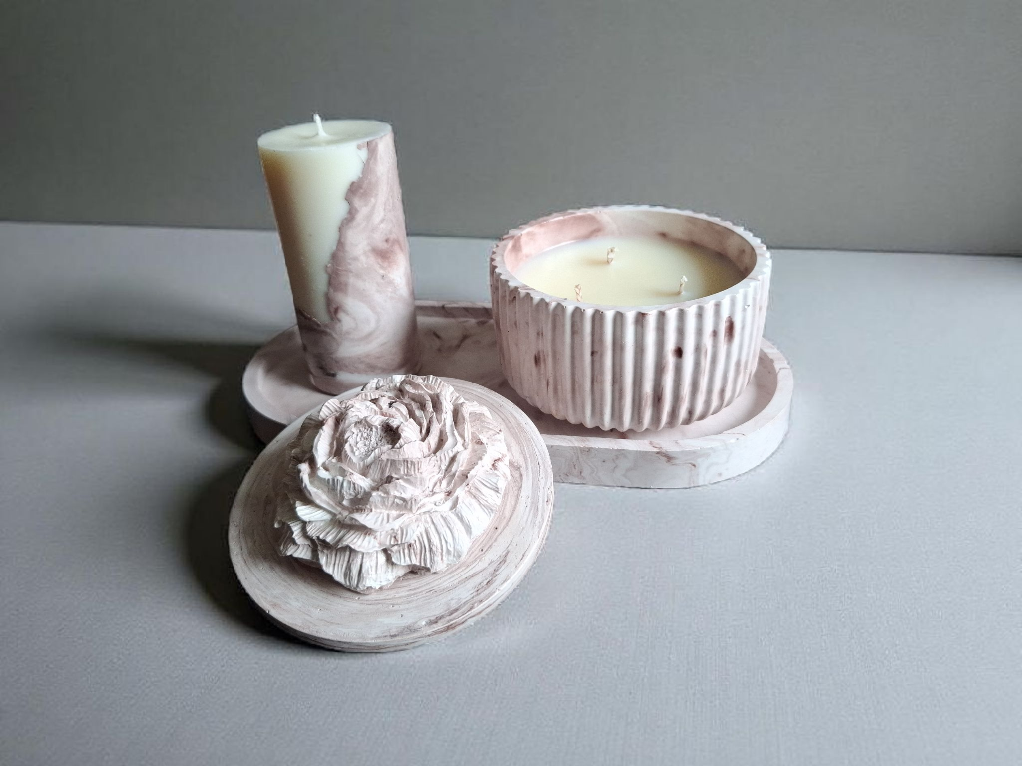 Minimalist handmade candle in gypsum container, sustainable soy wax.